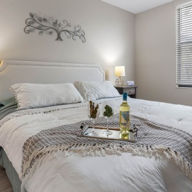 Bedroom with natural lighting and high ceilings